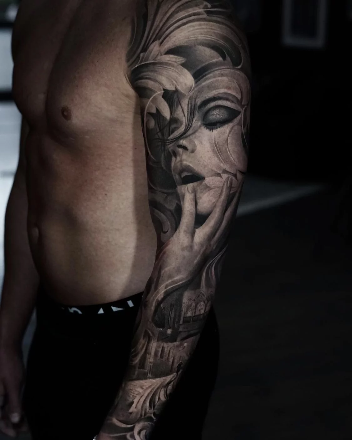 Surreal black and grey sleeve tattoo